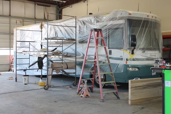 Class A motorhome undergoing repair inside Lodi RV Collision Center’s service facility in Lodi, CA